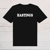 Hastings T-Shirt - black with white text, on front or back, ideal holidays, jokes, tours, gifts, trend setters will wear this! - Rainbowprint.uk